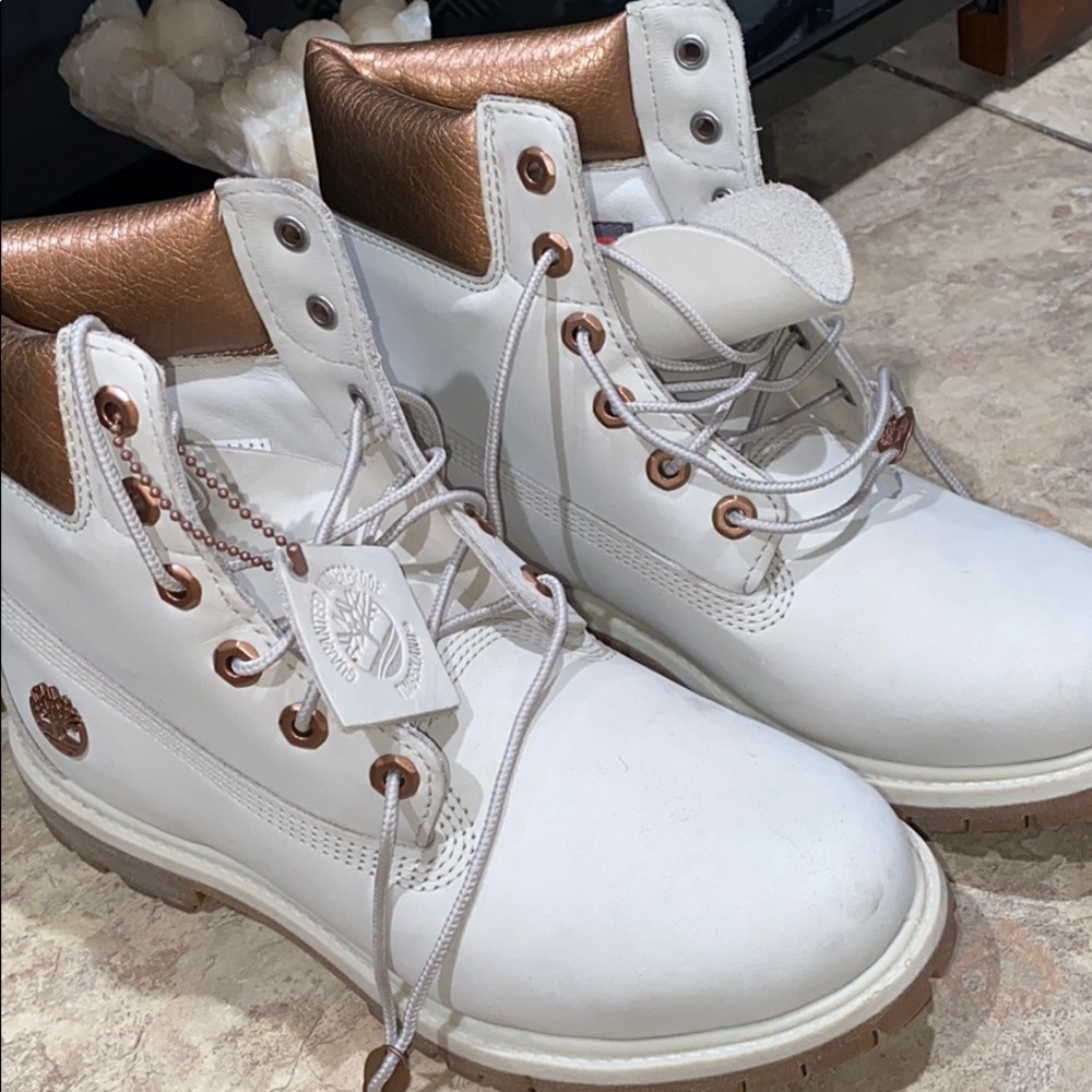 Rose gold and cream colored timberlands